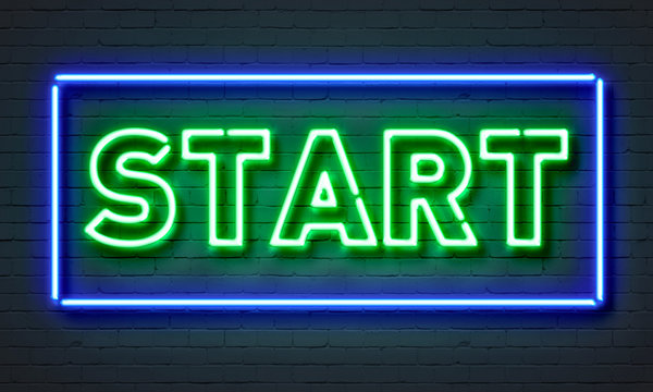 Start neon sign on brick wall background.