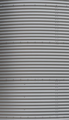 Obraz premium Panels of Corrugated Metal on Grain Silo