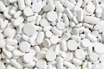 A lot of white medicine pills - 137616512