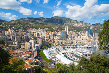 Principality of Monaco. View of the seaport and the city of Monte Carlo with luxury yachts and sail boats 