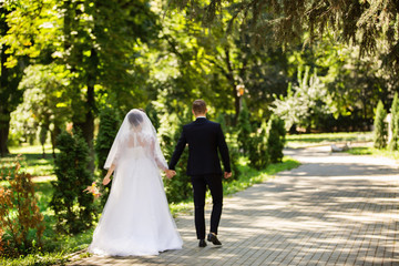 Blurred wedding photo with bride and groom in park. Wedding concept