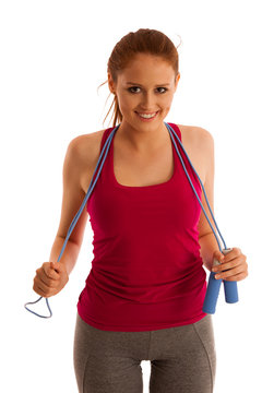 speed rope - woman with speed rope around her neck isolated over white background