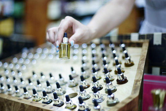 Person choosing a perfume in shop, Zagreb, Croatia, Euripe