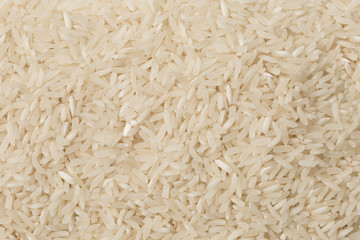 Uncooked white basmati rice textured as background.