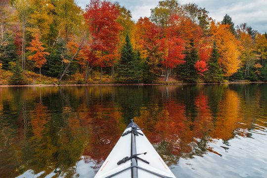 Kayaking in an autumn lake in upstate new york