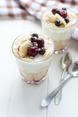 Healthy breakfast. Oatmeal with bananas, berries and honey