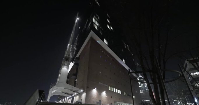 Hyperlapse sequence of the main entrance Elbphilharmonie in Hamburg with tilting up and paning at night in 4K