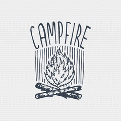 vintage old logo or badge, label engraved and old hand drawn style with campfire