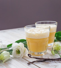 Traditional Homemade Eggnog and white eustoma flowers