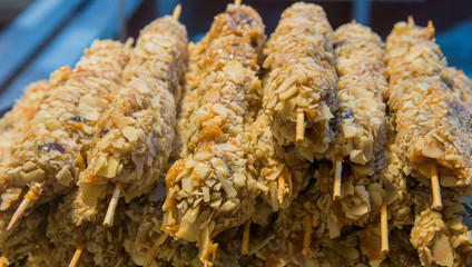 Sweets with sprinkles on stick closeup
