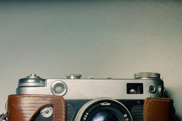 old vintage camera on a metal background