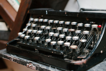 antique typewriter, vintage dusty typewriter, side view