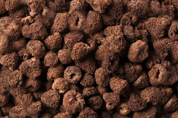Home dried brown Raspberry isolated texture background.