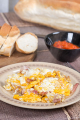 Fried eggs with bacon served on the table