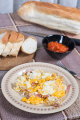 Breakfast table with fried eggs and bacon
