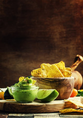 Corn nachos and avocado sauce, selective focus