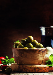 Green olives, cheese, tomatoes and wine, still life, selective focus