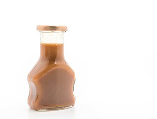 caramel bottle sauce on white