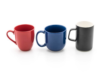 Set of black, red and blue cups on white