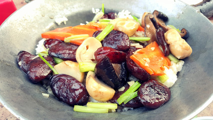 Fried rice with Chinese sausage in the pan