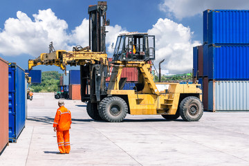 Forklift handling container box loading at the Docks with Truck