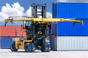 Forklift handling container box loading at the Docks with Truck