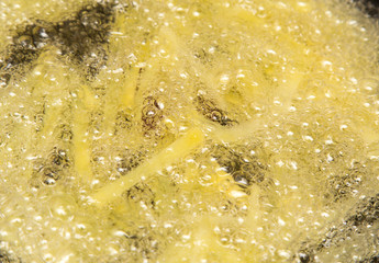 cooking potato fries in oil
