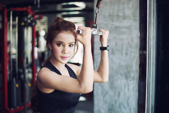 fitness woman doing exercises in the gym. Fitness - concept of healthy lifestyle. Fitness woman in the gym