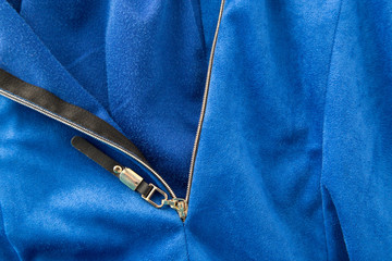 lock on blue fabric as a background