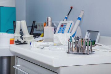 Close up photo of dental tools – drill burrs and denture polishers in a special holde