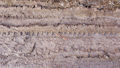 track from a car in a dirty ground