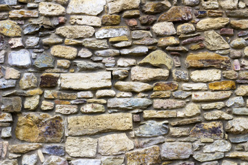 The wall of natural stone. Background