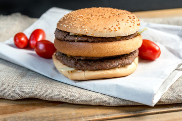 delicious American cheese burger with tomato
