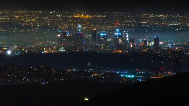 Timelapse of Los Angeles Skyline at night in Storm Clouds -Long Crop-