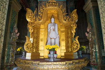 Fototapeta premium The sculpture of standing Buddha in the interior of the stupa Mahar Gandar Yone monastery. Myanmar