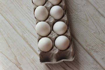 Fresh chicken eggs on a white background