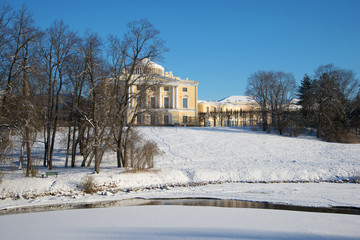 Fototapeta na wymiar Sunny winter day in Pavlovsk palace park. Vicinities of St. Petersburg, Russia
