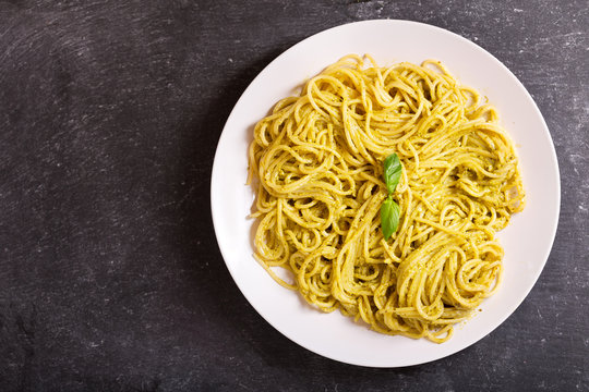 plate of pasta with pesto sauce