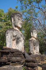Two ancient sculptures of the sitting Buddha on ruins of the temple of Wat Phra Kaeo. Kampayeng Pkhet, Thailand