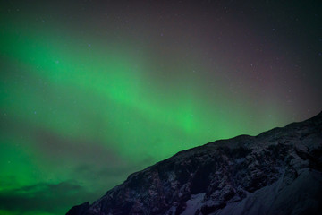 Northern lights over mountains in Iceland