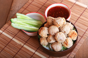 grilled meatball with spicy tamarind sauce  in bowl