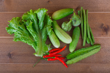 group of vegetable cucumbers,thai eggplants,long beens,Winged beans,lettuce,chilli.