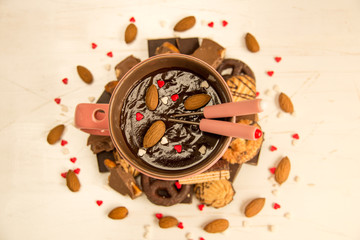 Chocolate fondue with almonds, close-up