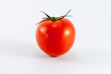 one fresh red tomato isolated on white