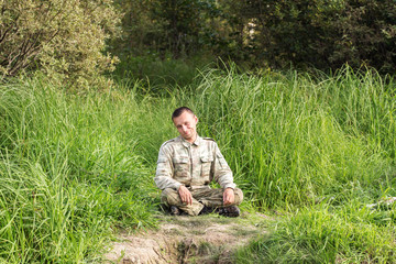 Fototapeta premium man resting on the grass