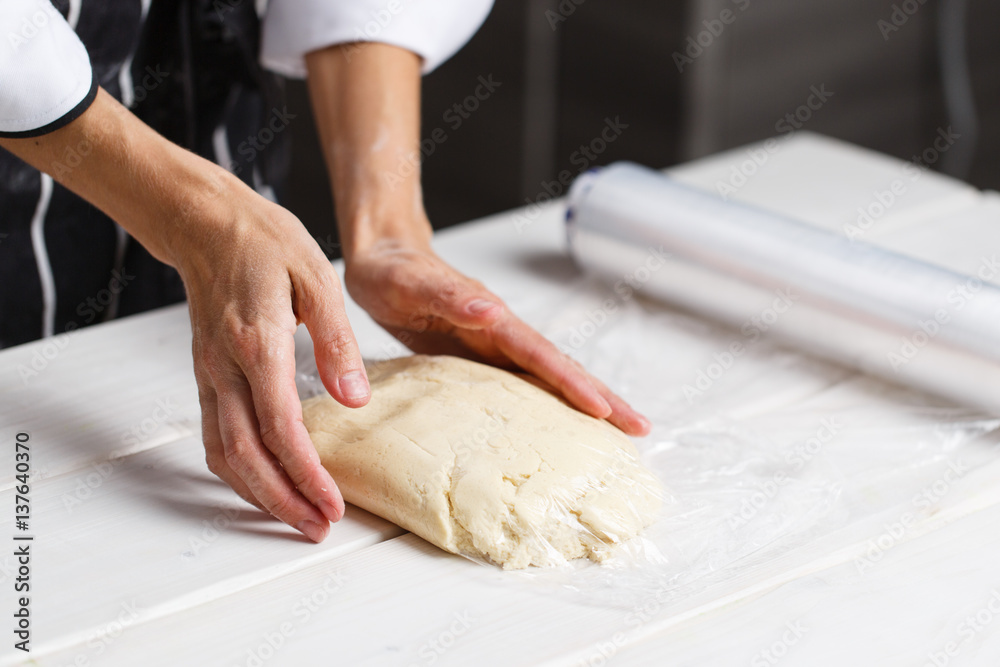 Wall mural kneading by women hands