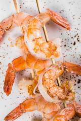 tasty spiced shrimp skewers on a barbecue