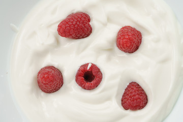 organic yogurt with fresh raspberries closeup