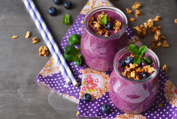 Berry yogurt with bran and oatmeal on a metal background