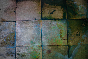 Surface of the old dirty big square tiles